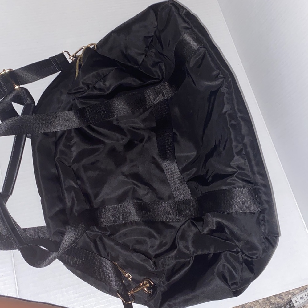 A•new•day black and gold weekend/travel bag